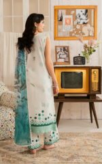Stunning 3-piece luxury organza suit in mint green with all-over floral digital print, embroidered yoke, lace neckline, and pearl button placket. Comes with a printed organza dupatta and scalloped cambric trouser. Perfect for Eid and formal gatherings.